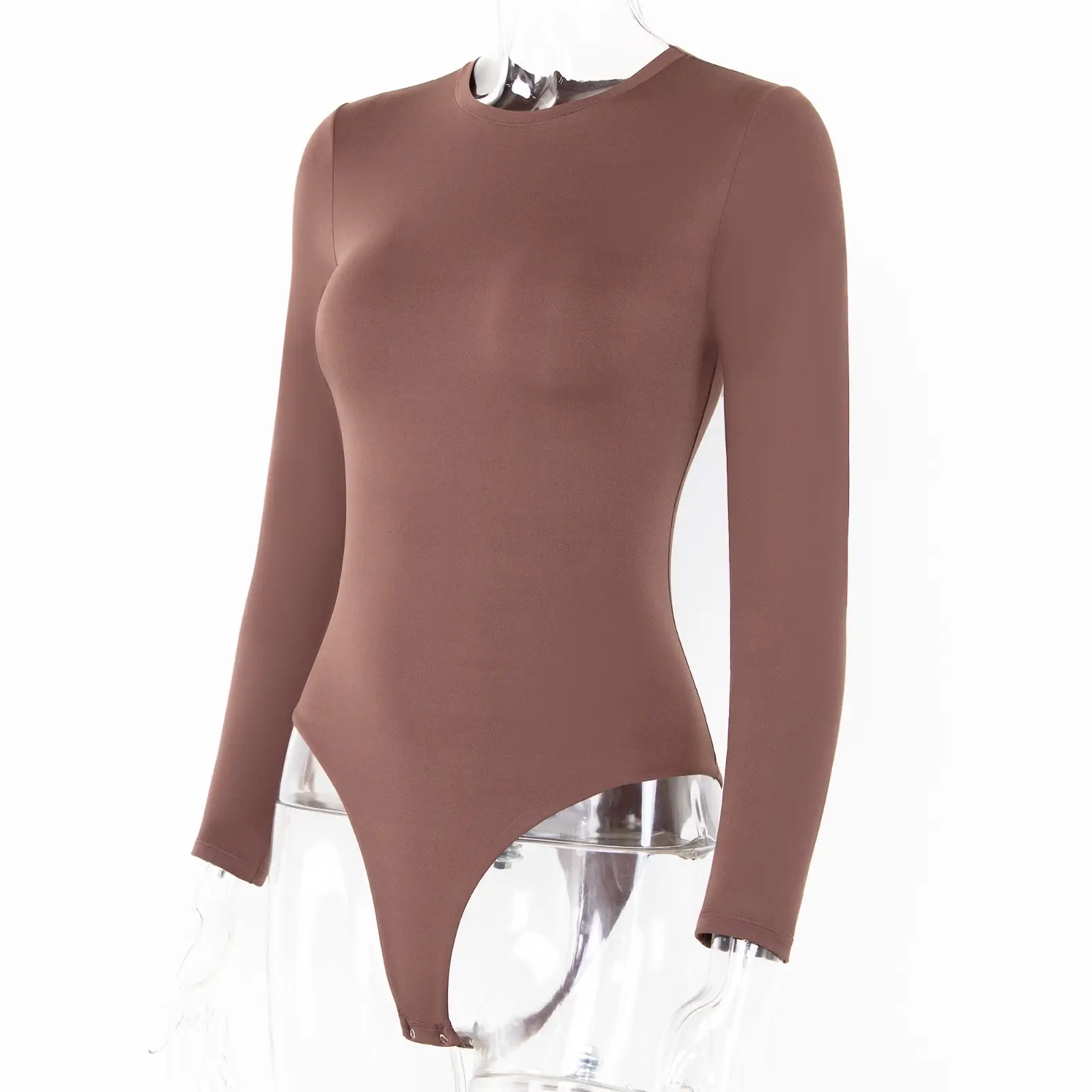 Headless mannequin modeling a brown long sleeve bodysuit over a white background.
