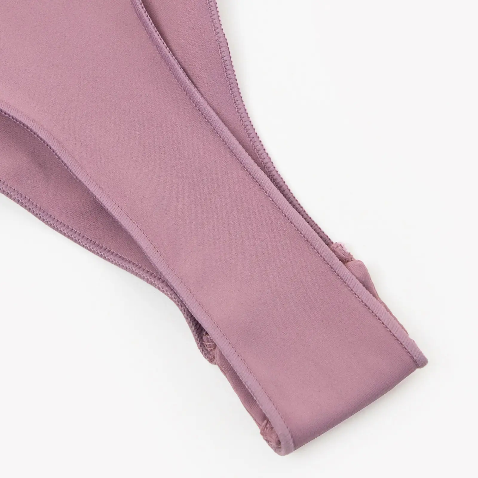 Close-up of light pink bodysuit thong